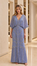 Front view of woman wearing blue beaded evening maxi dress
