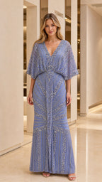Front view of woman wearing blue beaded evening maxi dress
