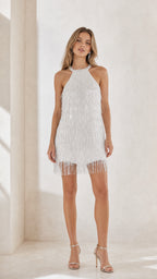 Front view of white halter beaded fringe mini dress