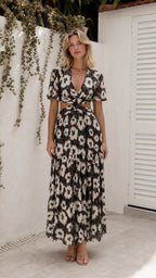 Front view of model wearing black floral cutout maxi dress