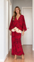 Model wearing red tie-dye two-piece set from the front