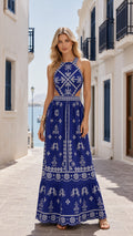 Model wearing royal blue embroidered cutout halter maxi dress front view