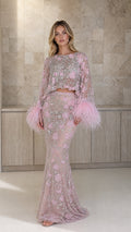 Front view of model wearing pink embellished two-piece feather trim set