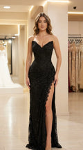 Front view of black sequin lace strapless evening gown with high slit