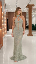 Front view of sage halter beaded evening gown