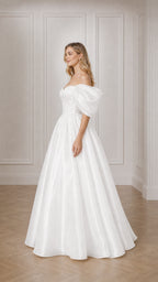 Side profile of woman in white satin ball gown