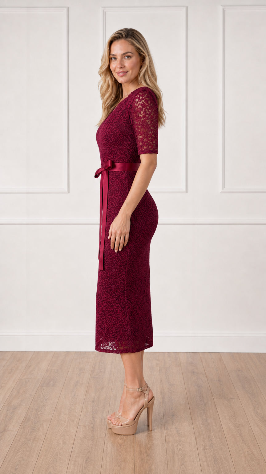 Side profile view of burgundy lace midi dress