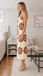 Side view of cream geometric embroidered midi dress