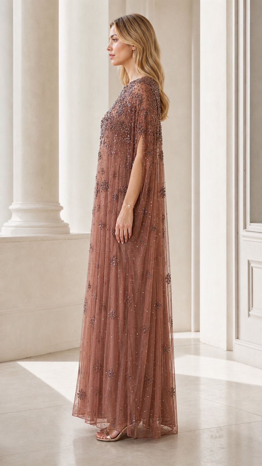 Side profile view of dusty rose evening gown
