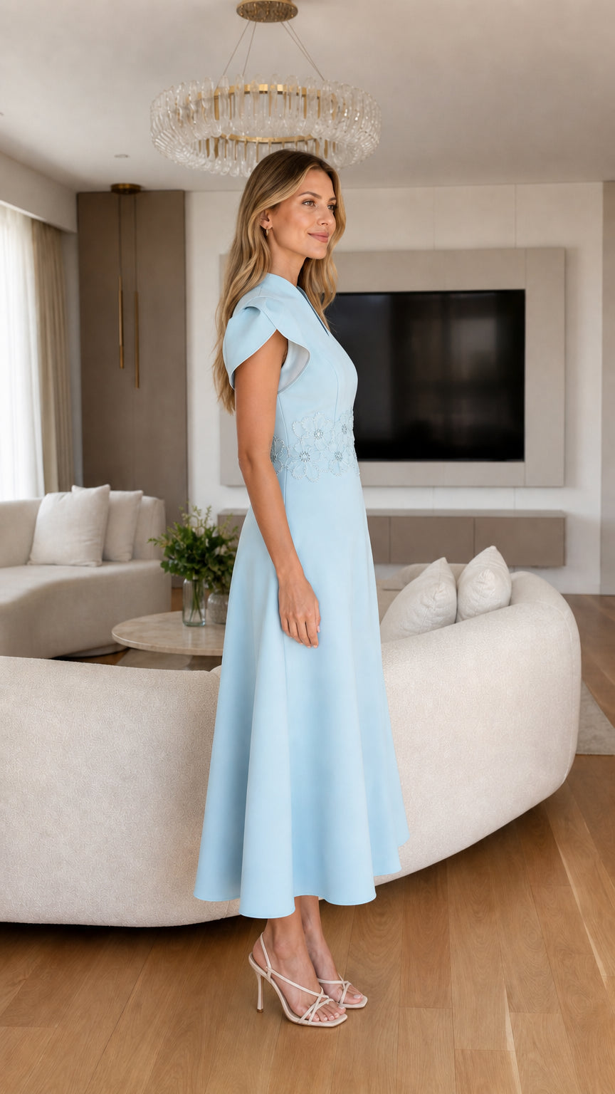 Side profile of light blue midi dress with cap sleeves