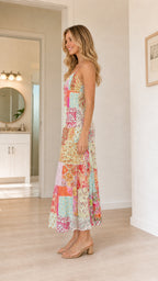 Side profile view of multi color patchwork midi slip dress