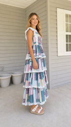 Side profile view of multi patchwork tiered maxi dress