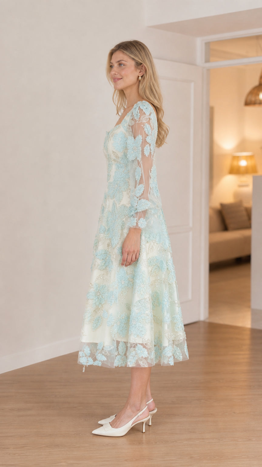 Side profile of model in mint midi dress