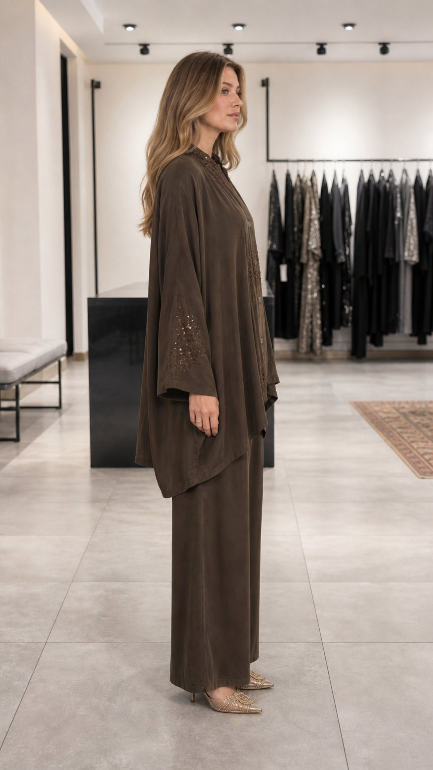 Side view of model wearing brown embroidered lounge set