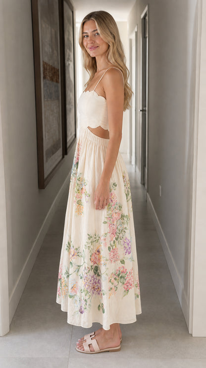 Woman wearing ivory floral cutout midi dress side view