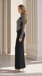 Side profile view of black evening gown