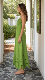 Side profile view of green maxi dress