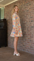 Side profile view of multicolor floral mini dress