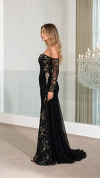 Side profile view of black evening gown showing silhouette and train