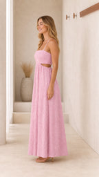 Side profile view of pink textured maxi dress