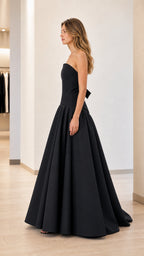 Side profile view of black evening gown