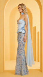Side profile view of light blue formal gown