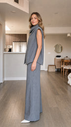 Side view of model wearing grey pinstripe matching set