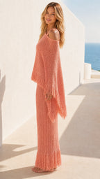 Side view of model in coral knit two-piece set