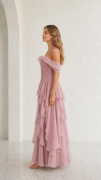 Side profile view of mauve off-shoulder dress