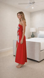 Side view of model in red strapless floral dress