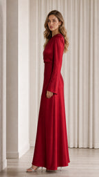Side profile view of model in red satin gown