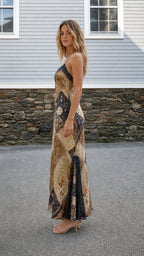 Side profile of model wearing Brown Multi maxi dress