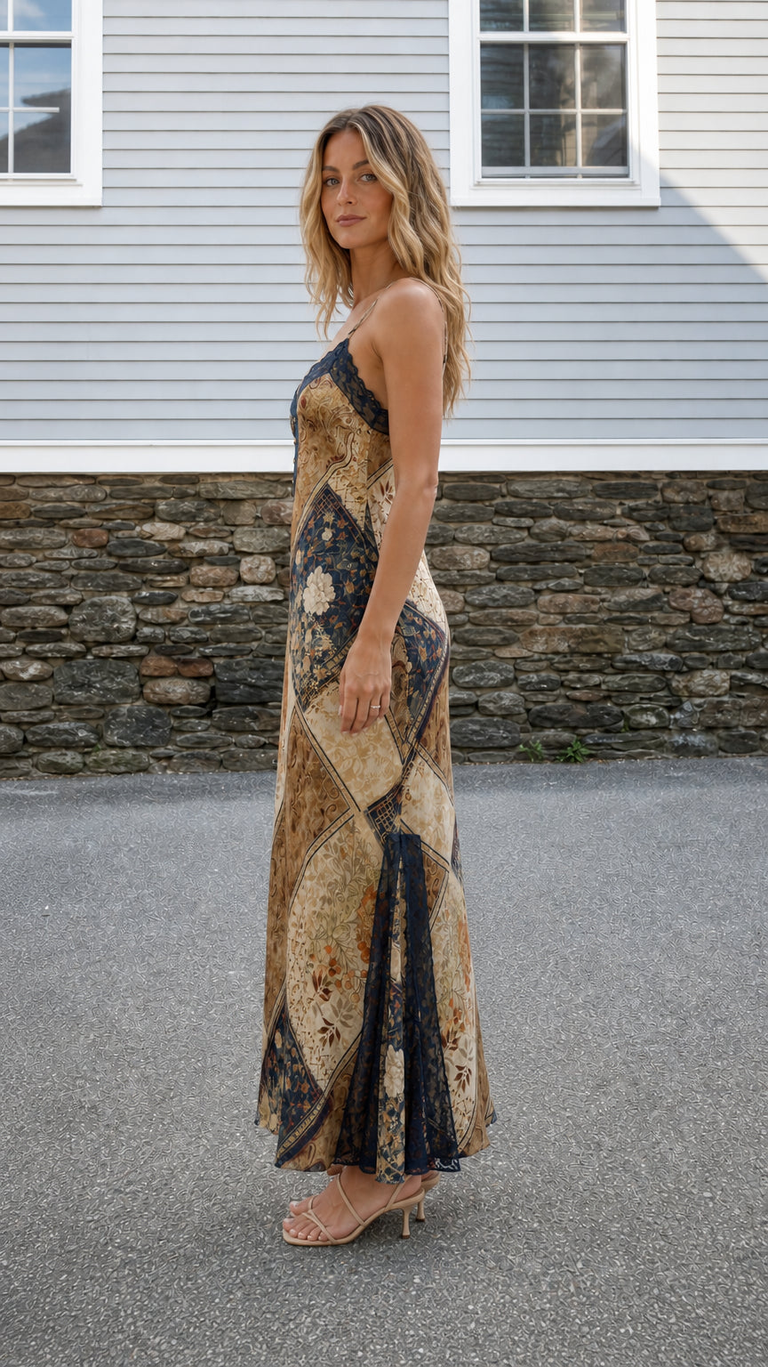 Side profile of model wearing Brown Multi maxi dress