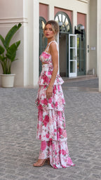 Side profile view of model in pink floral tiered maxi set