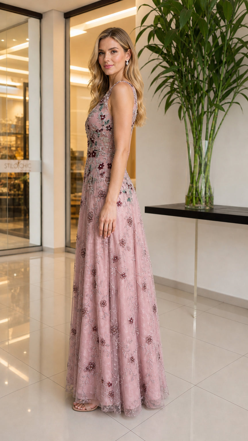 Side profile of model in blush pink gown