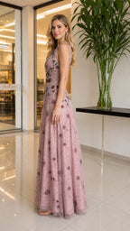 Side profile of model in blush pink gown