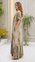 Side profile view of beige kaftan dress showing side pockets