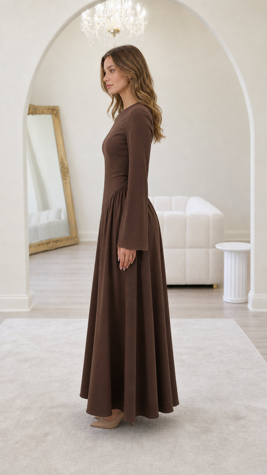 Side profile of model in brown maxi dress