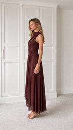 Side profile of burgundy pleated maxi dress