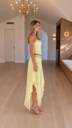 Side profile view of yellow two-piece set