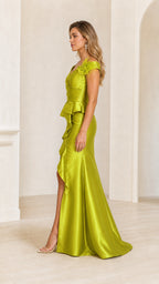 Model wearing lime green satin evening dress side profile