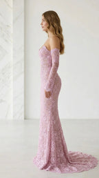 Side profile of pink lace evening gown with train