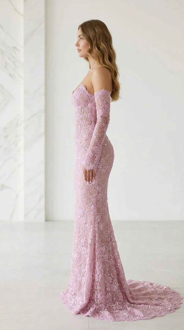 Side profile of pink lace evening gown with train