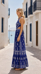Model wearing royal blue maxi dress side profile