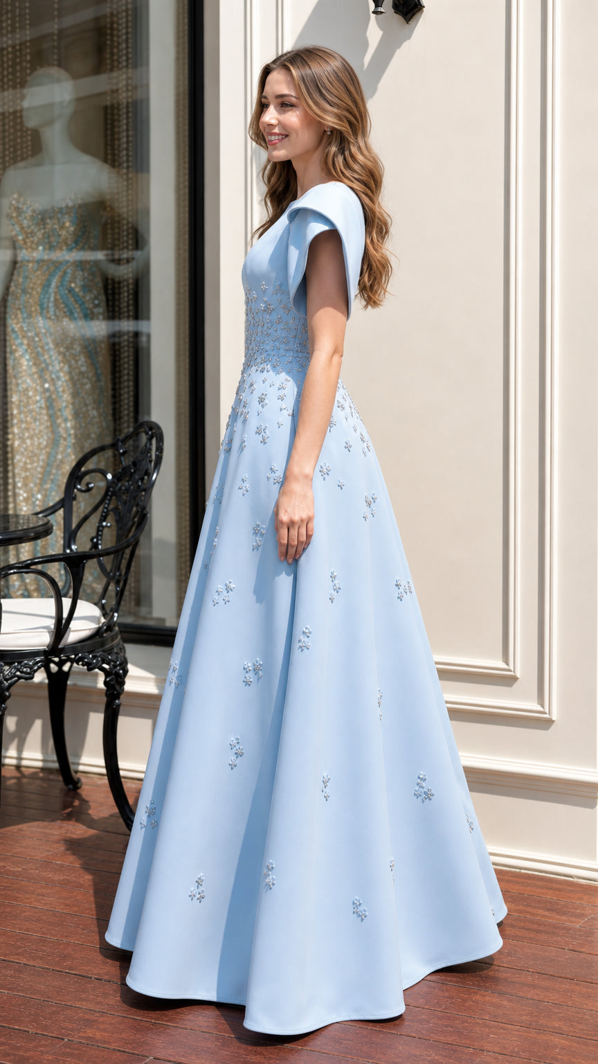 Side profile of light blue evening gown with flared sleeves
