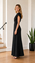 Model wearing Black one-shoulder maxi dress from side profile