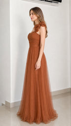 Side profile of rust brown tulle gown