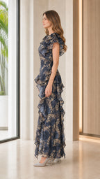 Side profile view of navy floral maxi dress with heels