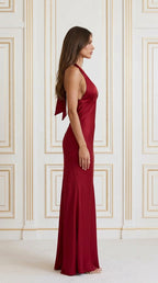 Side profile of model wearing Burgundy satin maxi dress