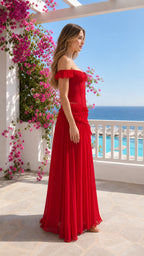 Side profile view of woman in red corset chiffon maxi dress